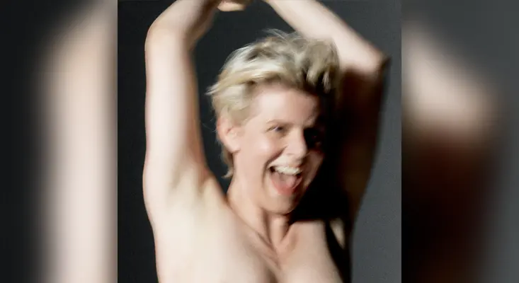 Official album cover for Sexistential by Robyn, featuring a joyful, raw portrait of the singer.