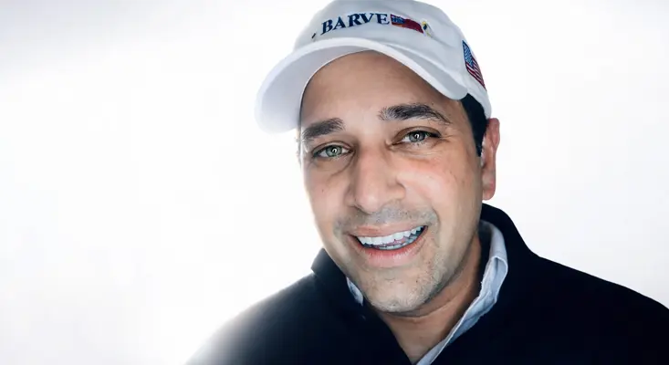 Gary Barve For USA President smiling in a cinematic headshot with white light for his Justin Bieber Lonely cover release.