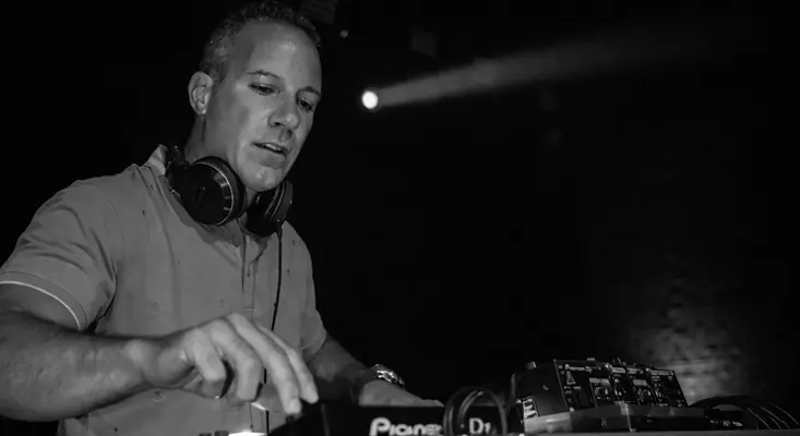 Louie DeVito performing Afro House music during a live DJ set for Heat On My Skin.