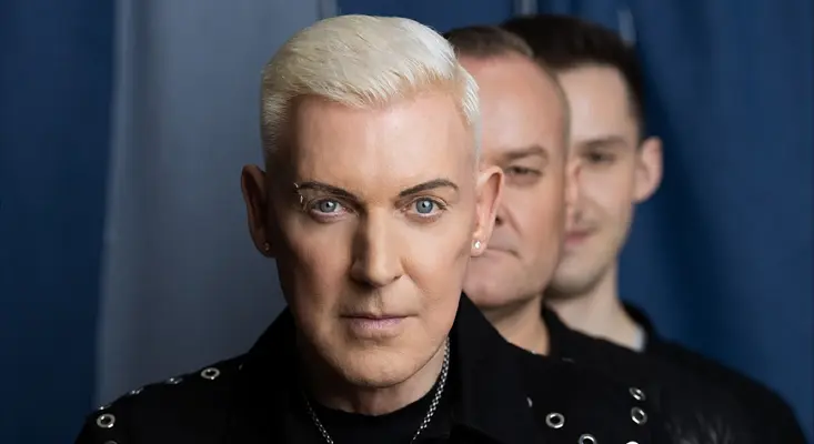 Earthshaking Music: W&W, Scooter - Rave From Outer Space Scooter band members led by H.P. Baxxter in a close-up promotional photo for their 2026 collaboration "Rave From Outer Space" with W&W.