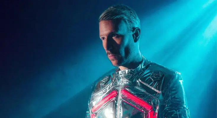 Don Diablo wearing a futuristic silver metallic suit with red neon lights for his Lete Sound collaboration.