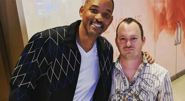 Josh Linsk with Will Smith at an event.