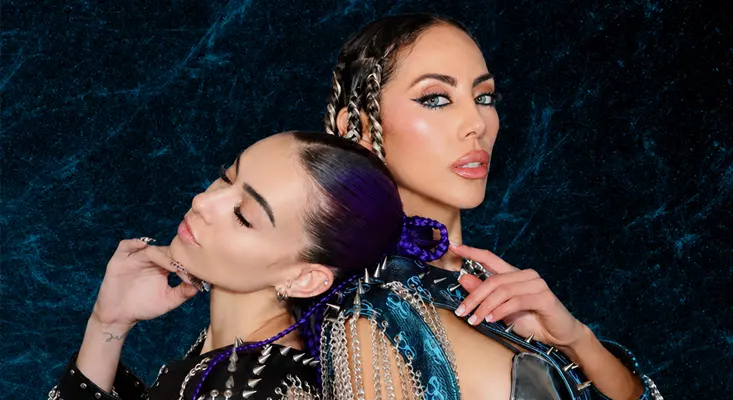 ANAYA and Aviella posing back to back for their uplifting music collaboration "By My Side."