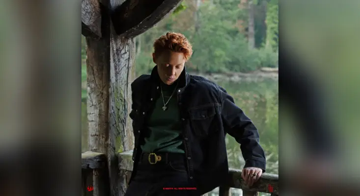 La Roux - Cabin Fever La Roux Cabin Fever single cover art 2026 - Elly Jackson in black jacket by rustic cabin.