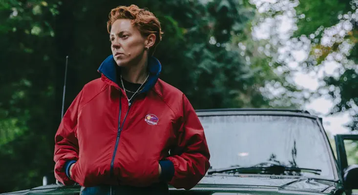 La Roux Reappears With New Song And Video “Cabin Fever” La Roux in a red jacket standing by a vintage car for the Cabin Fever single and Old Flames album.