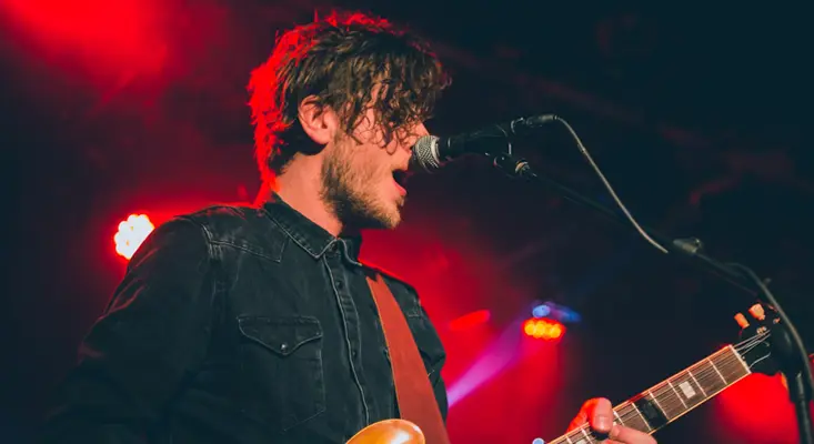 Indie artist performing live before a streaming debut release.