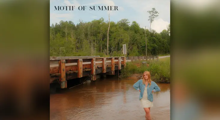 Motif of Summer cover art by Samantha LaPorta standing in a river under a wooden bridge.