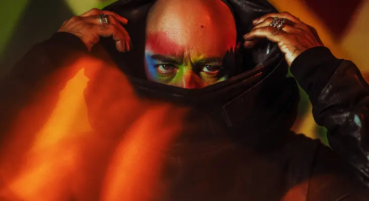 Roger Sanchez promoting his new House music album ‘Spectrum’ with dramatic neon lighting.
