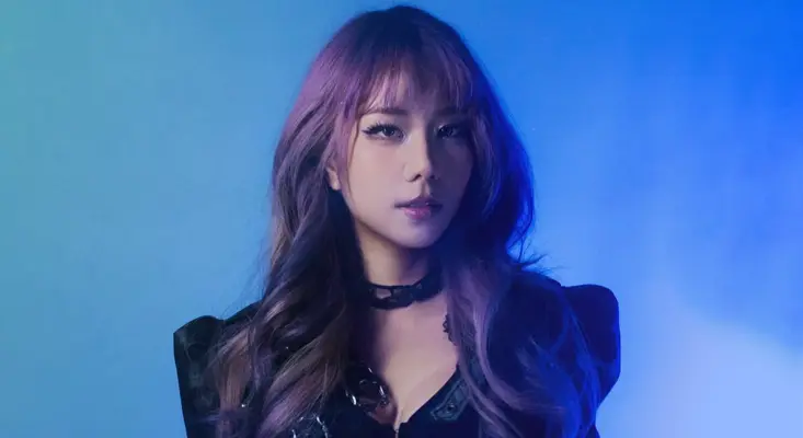 JVNA Turns Scoring For Video Games Into EDM On “Digital Ghost” JVNA poses against a blue background for her single Digital Ghost.