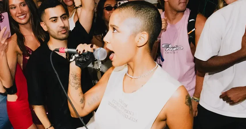 Tokischa commands the crowd during a live performance, embodying the bold, unapologetic energy behind her EDM Latin collab with Major Lazer.