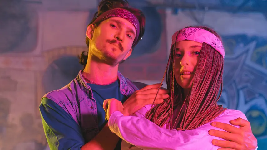 How Hip-Hop Music Connects To Its Iconic Fashion Statement Hip-Hop fashion featuring two artists wearing modern streetwear inspired by urban culture and contemporary style.