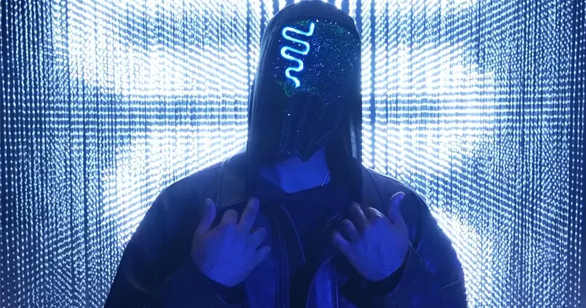 Canadian DJ and producer Sickick wearing his signature glowing blue neon mask.