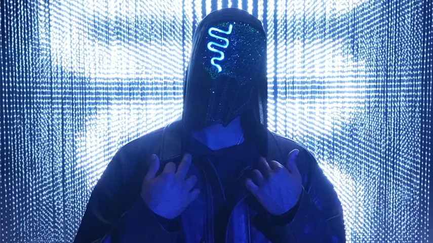 Canadian DJ and producer Sickick wearing his signature glowing blue neon mask.
