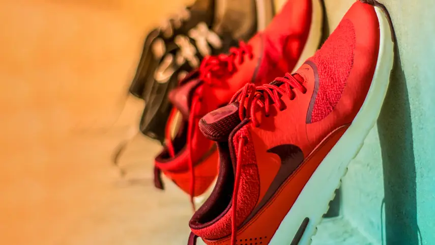 Red sneakers representing Hip-Hop fashion, sneaker culture, and modern streetwear style.