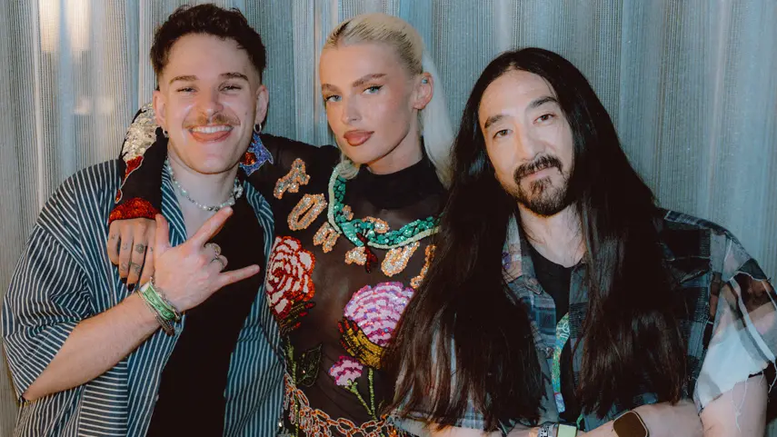 Steve Aoki, Ely Oaks And SACHA Unite On Trance Gem “Gravity” Steve Aoki, Ely Oaks, and SACHA pose together to promote their Vocal Trance single "Gravity."