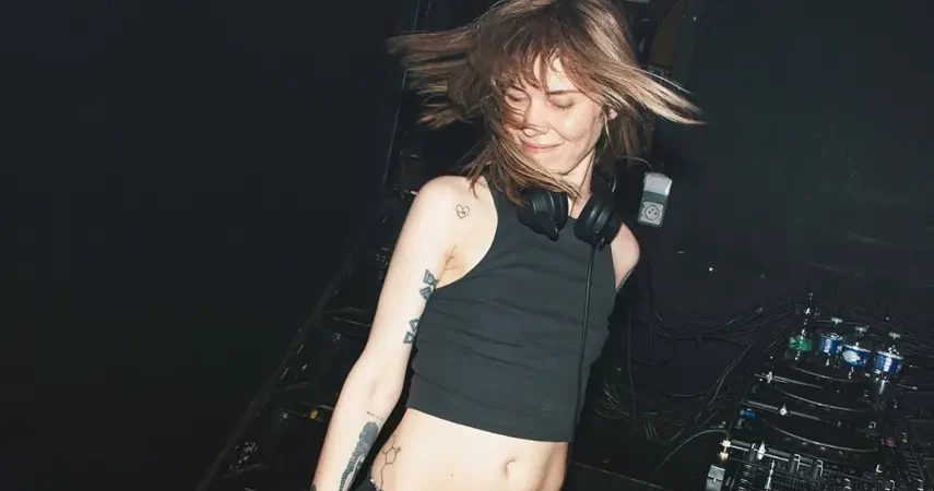 Mija dancing behind DJ decks at a Berlin club during On The Floor video shoot.