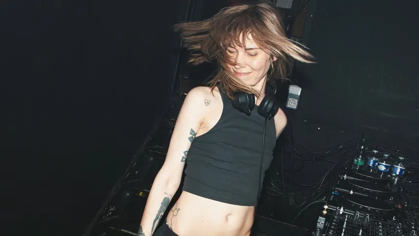 Berlin Dance Music Scene Fuels Mija's “On The Floor” Video Mija dancing behind DJ decks at a Berlin club during On The Floor video shoot.