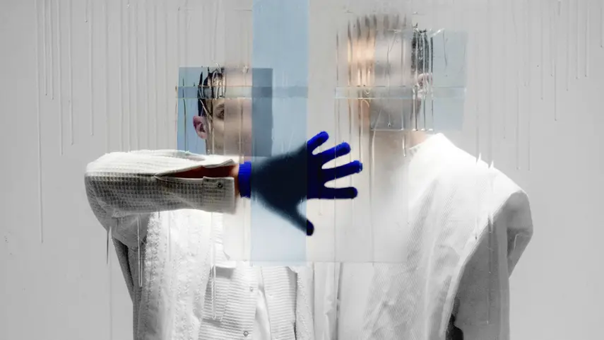 Dejan Dejado and Andreas Schütz hope 'Lucent' offers listeners a moment of calm and escape. Dejan Dejado and Andreas Schütz behind glass with blue glove for Lucent album.
