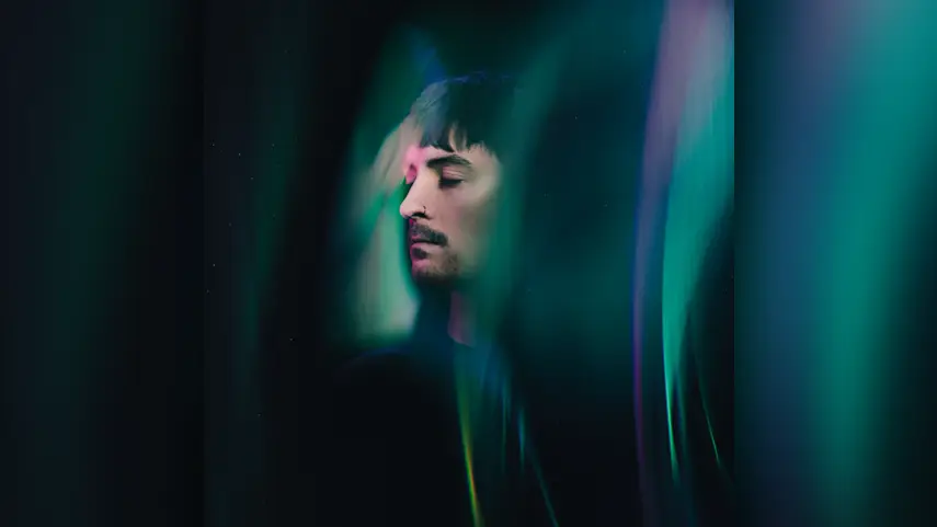 Justin Hawkes - Now Or Never Now Or Never album cover art shows Justin Hawkes in teal and pink light streaks.
