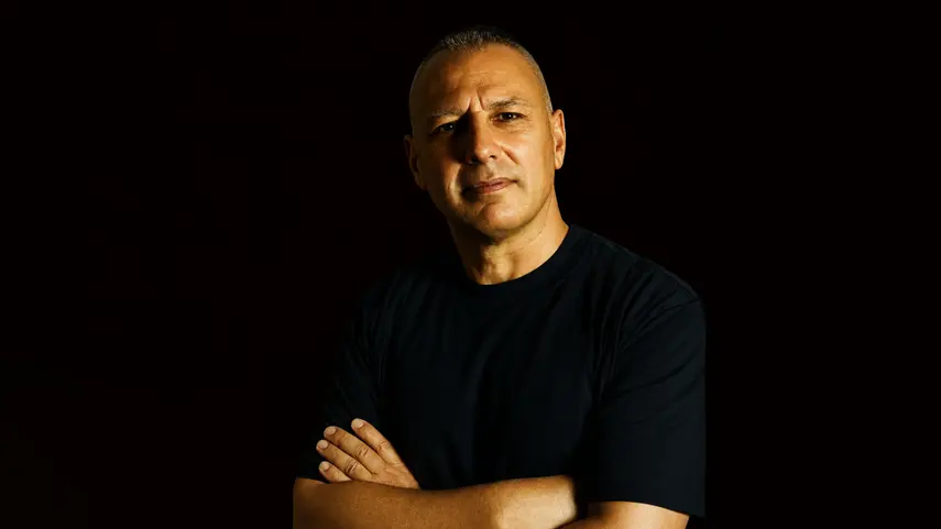 Mr. Rustle, Italian DJ and producer behind the Tech House track "Alone," in a moody portrait.