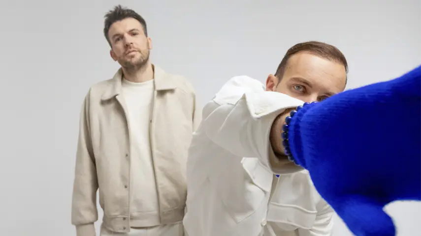 Dejan Dejado and Andreas Schütz open up about the emotional pressure behind their album 'Lucent.' il:lo duo Dejan Dejado and Andreas Schütz in closeup pose for Lucent album interview.
