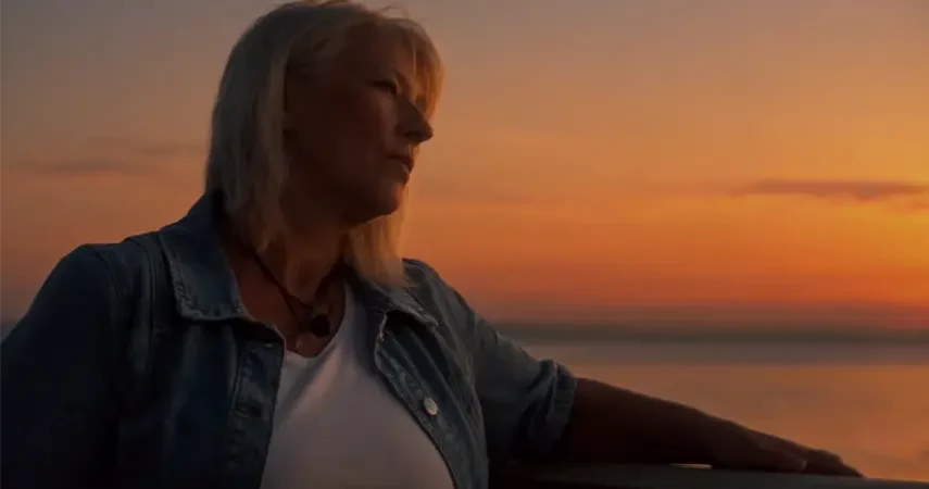Camilla Billström of 2FRIENDS gazes at the sunset in Just One Night music video.