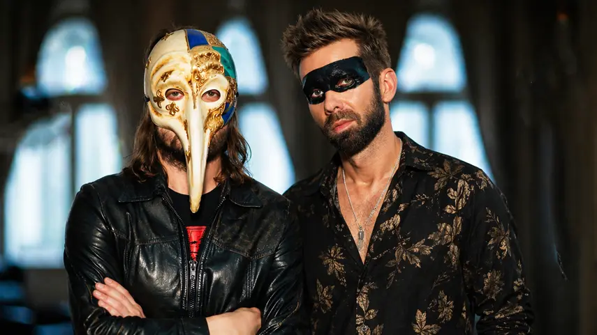 Italove duo wearing masks in promo photo for "We Could Be Lovers" single.