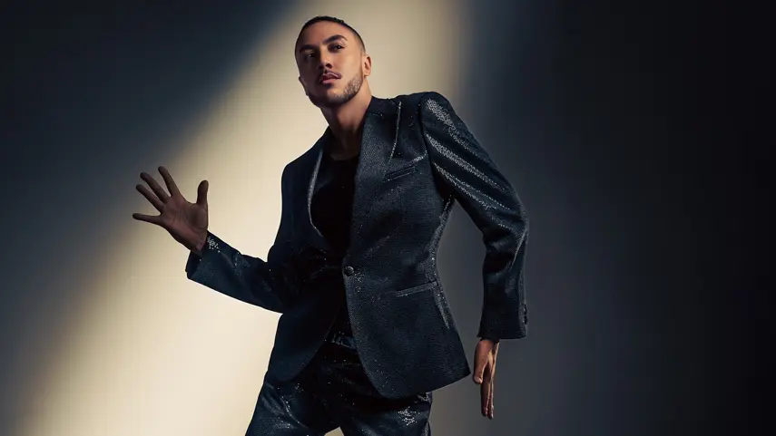 Dominique Debuts With House Single “You're A Star (Get On Up)” Dominique poses in a sequined black suit for his debut single "You're a Star (Get on Up)".