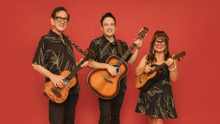 Slack Key ʻOhana family trio holding ukuleles and guitar for The ʻOhana Sessions album.